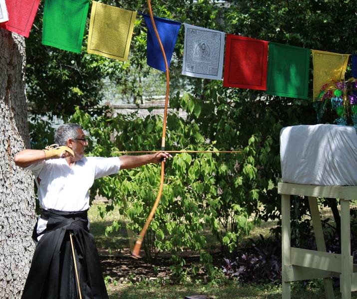 Toby demonstrates makiwara practice at the Austin Zen Center's Spring Fair.