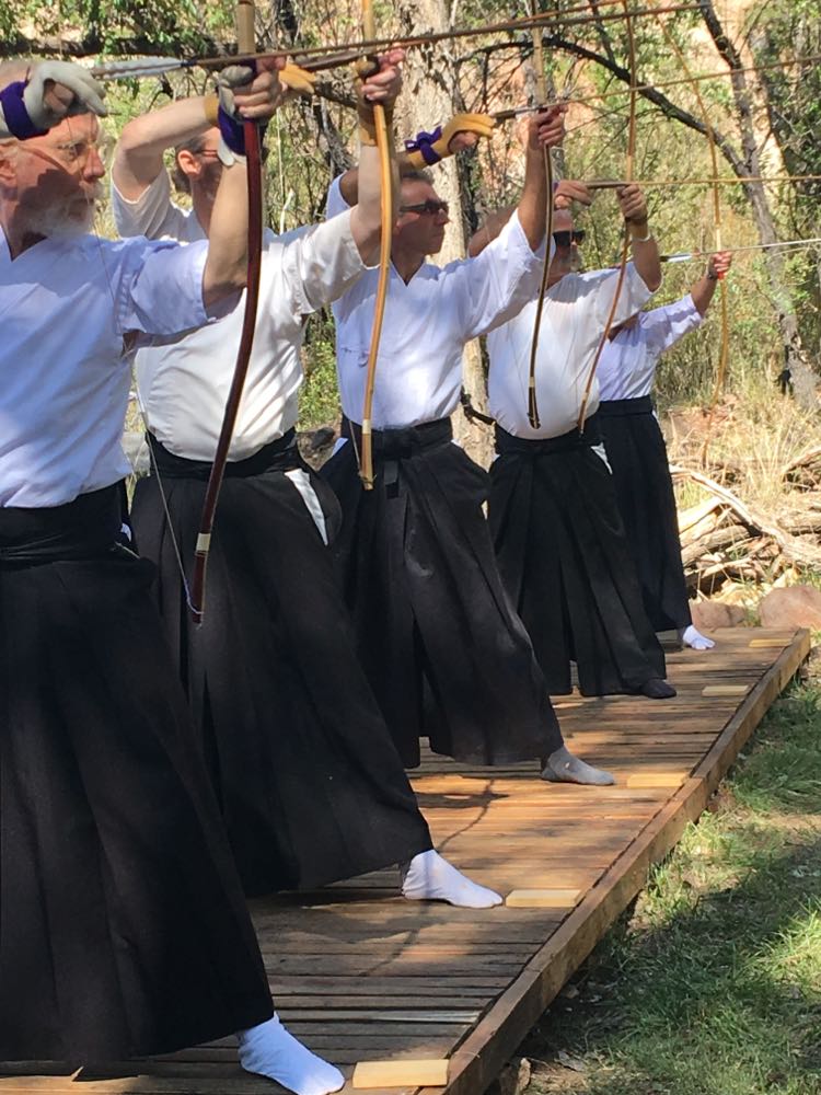 Nestor (center) practicing with others at a retreat in New Mexico.